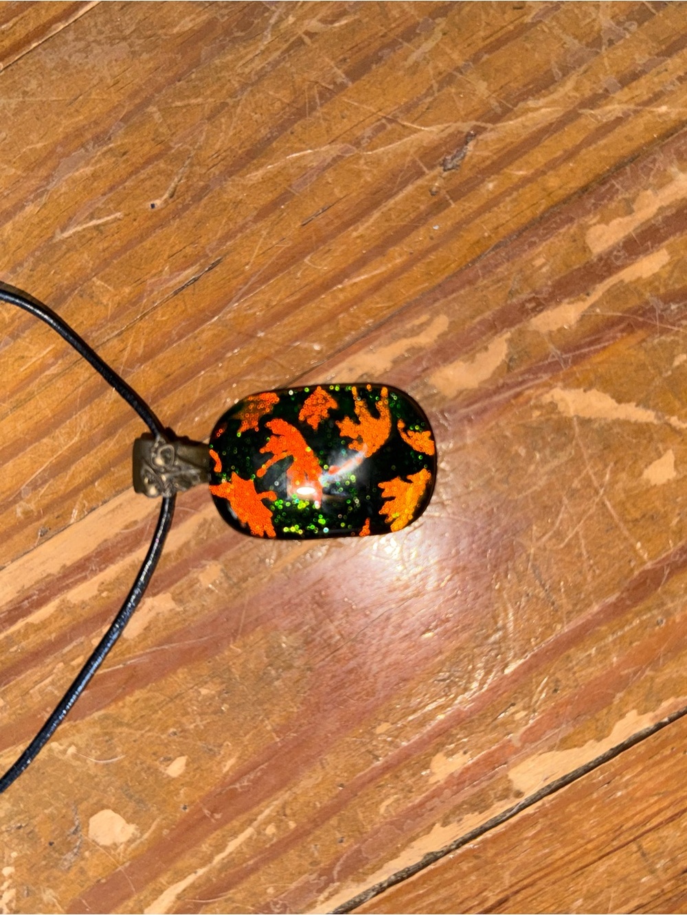 Unbranded Black Pendant Necklace with Orange Leaf Design